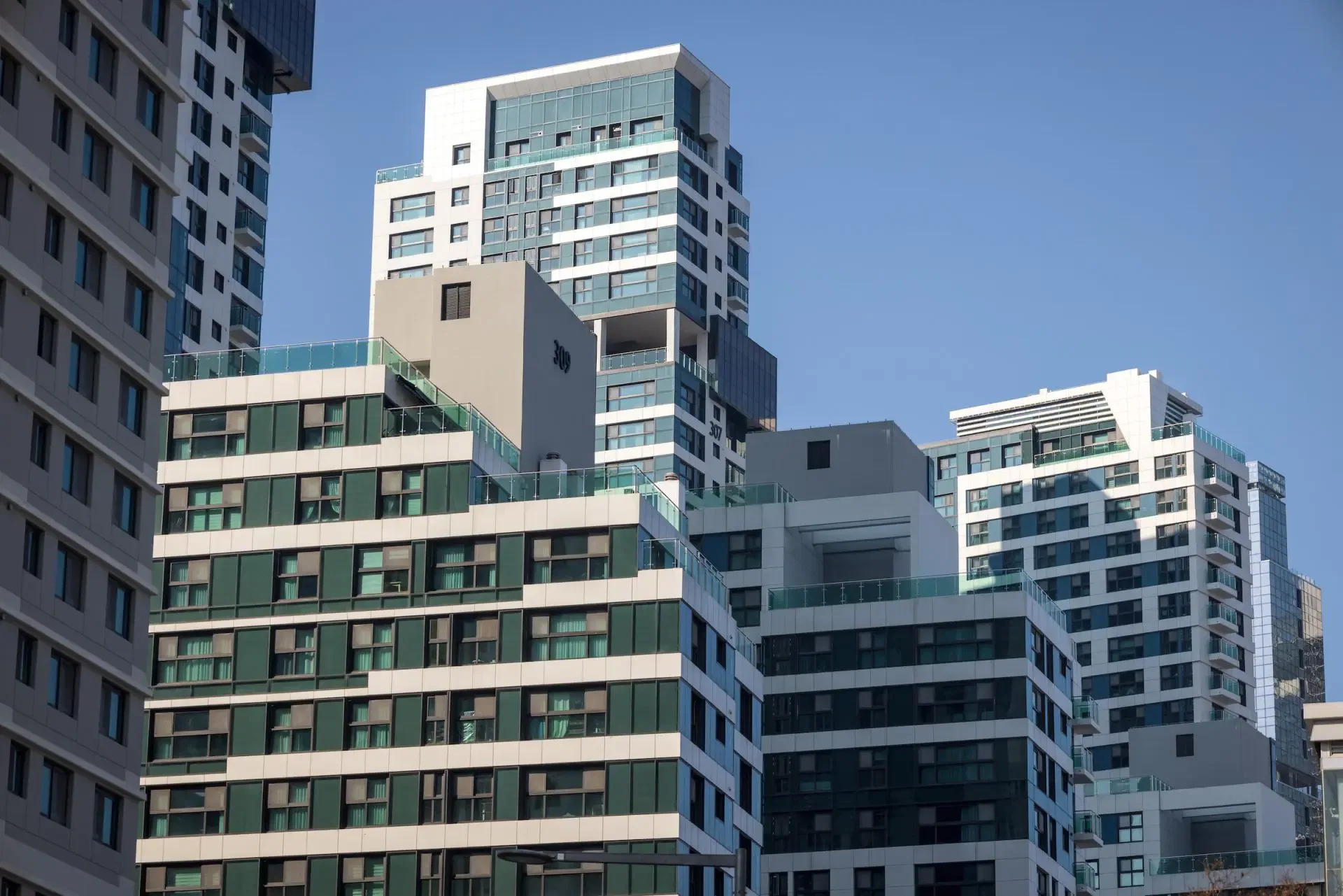 Modern Sydney apartment buildings. Strata insurance claim example.