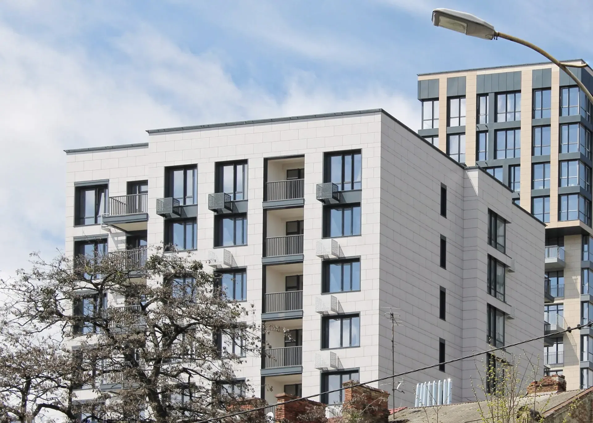 A modern block of apartments on a clear day.