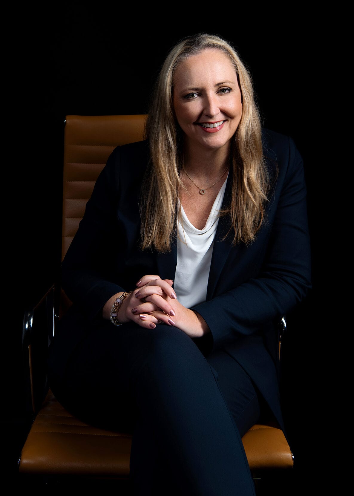 Confident businesswoman sitting in an office chair