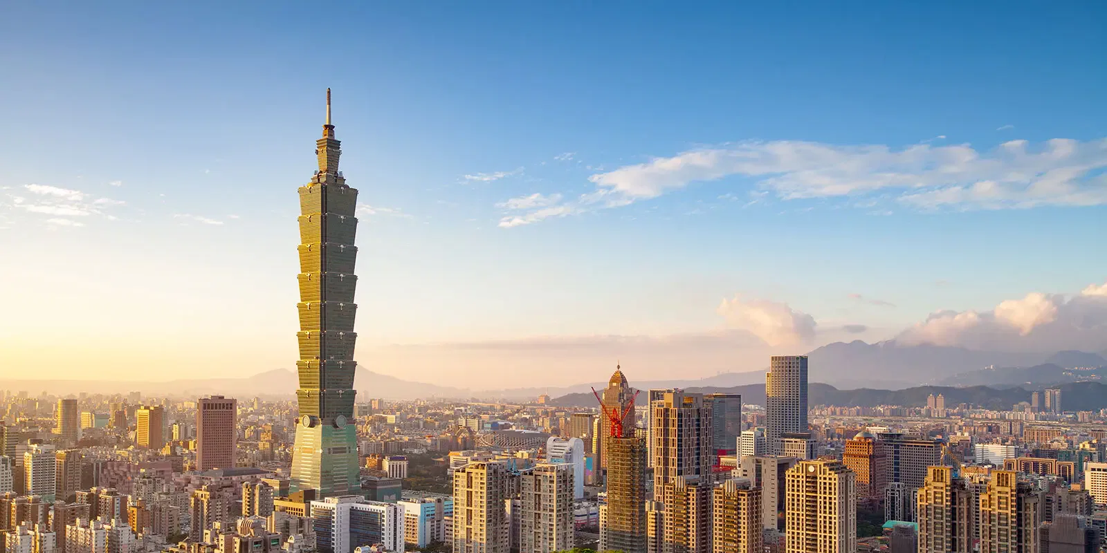 Taipei 101 skyscraper and cityscape at sunset. International estate planning in Taiwan.