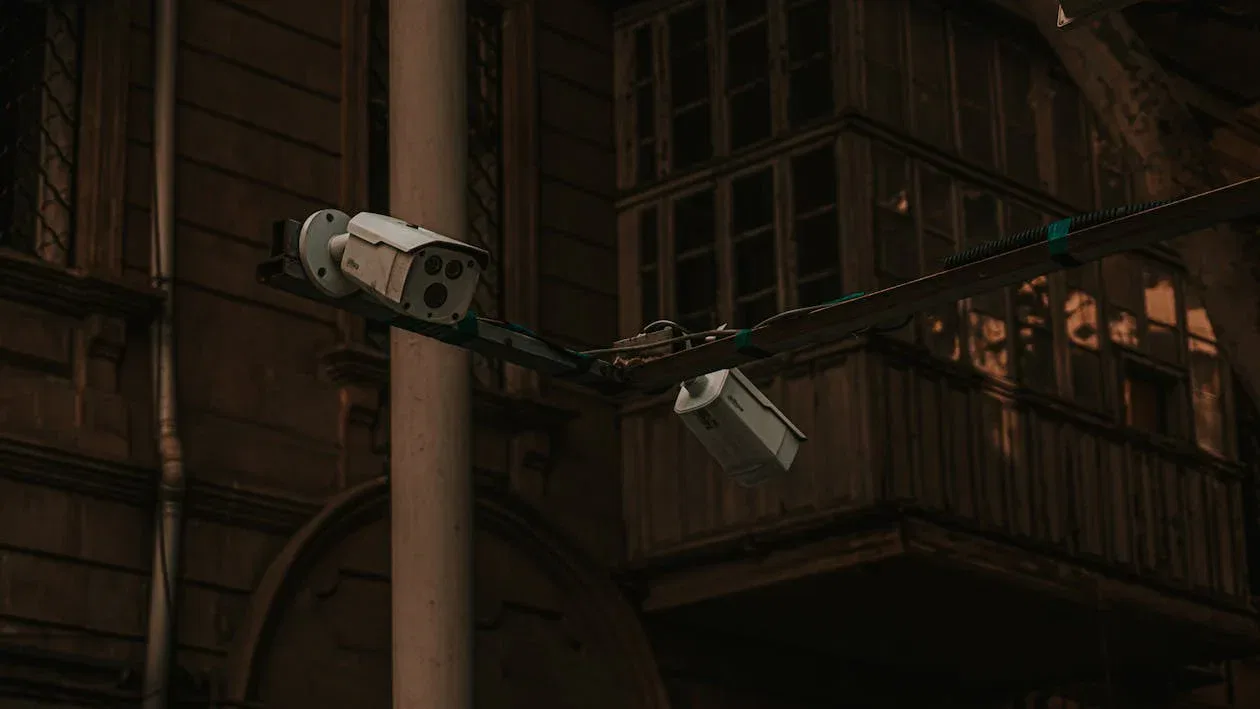 CCTV cameras mounted outside a building, highlighting legal rules and privacy laws for NSW strata community.