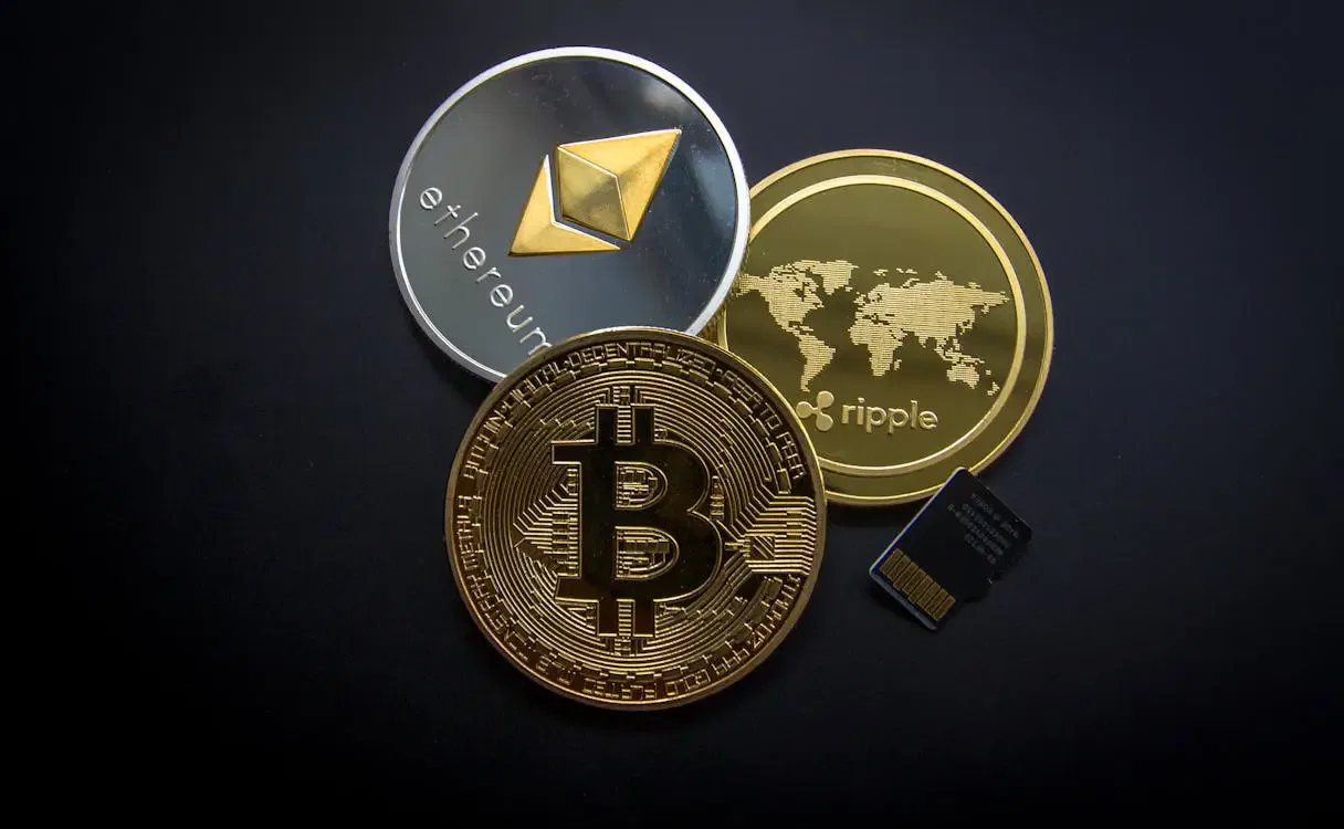 Cryptocurrency coins and a microSD card symbolize estate planning with crypto, inheritance, and smart contracts.
