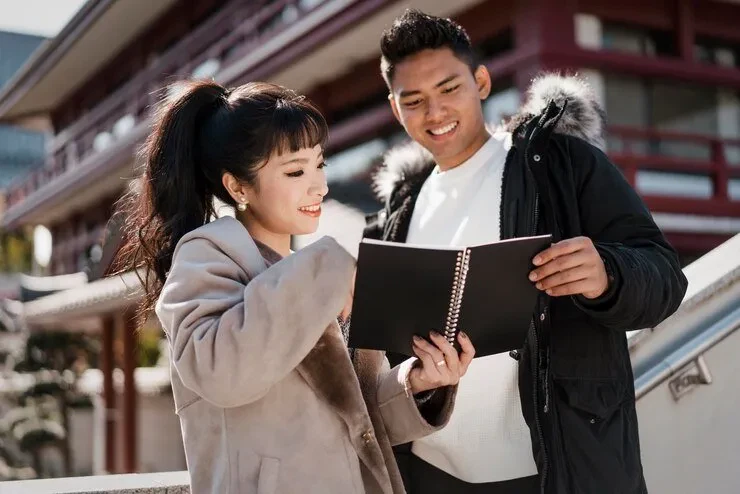 Young couple reviewing estate planning documents in China.
