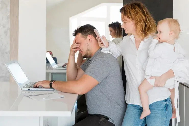 Stressed man working on laptop, woman holding baby, family facing will contest deadline. NSW family law.