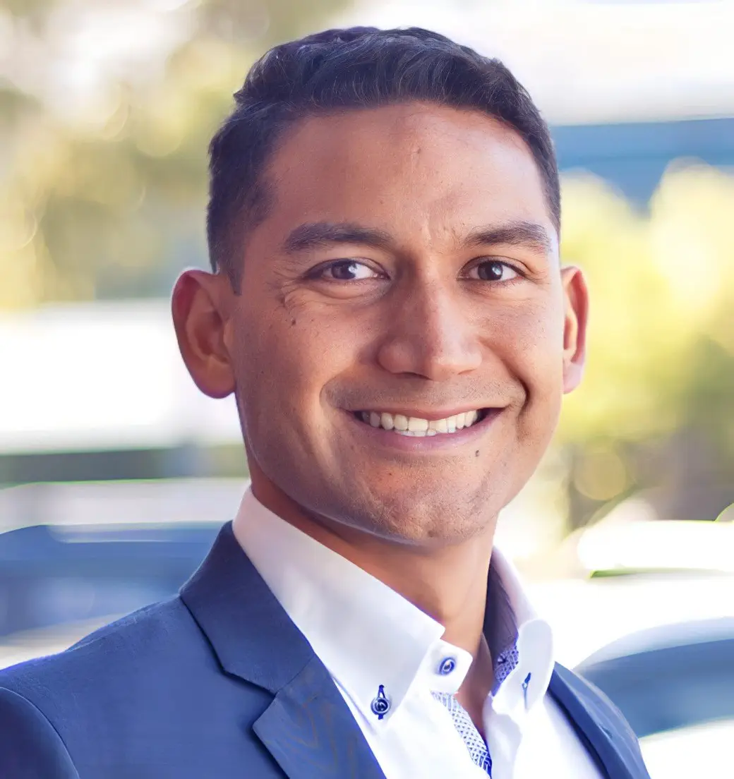 Portrait of a smiling man in a blue suit