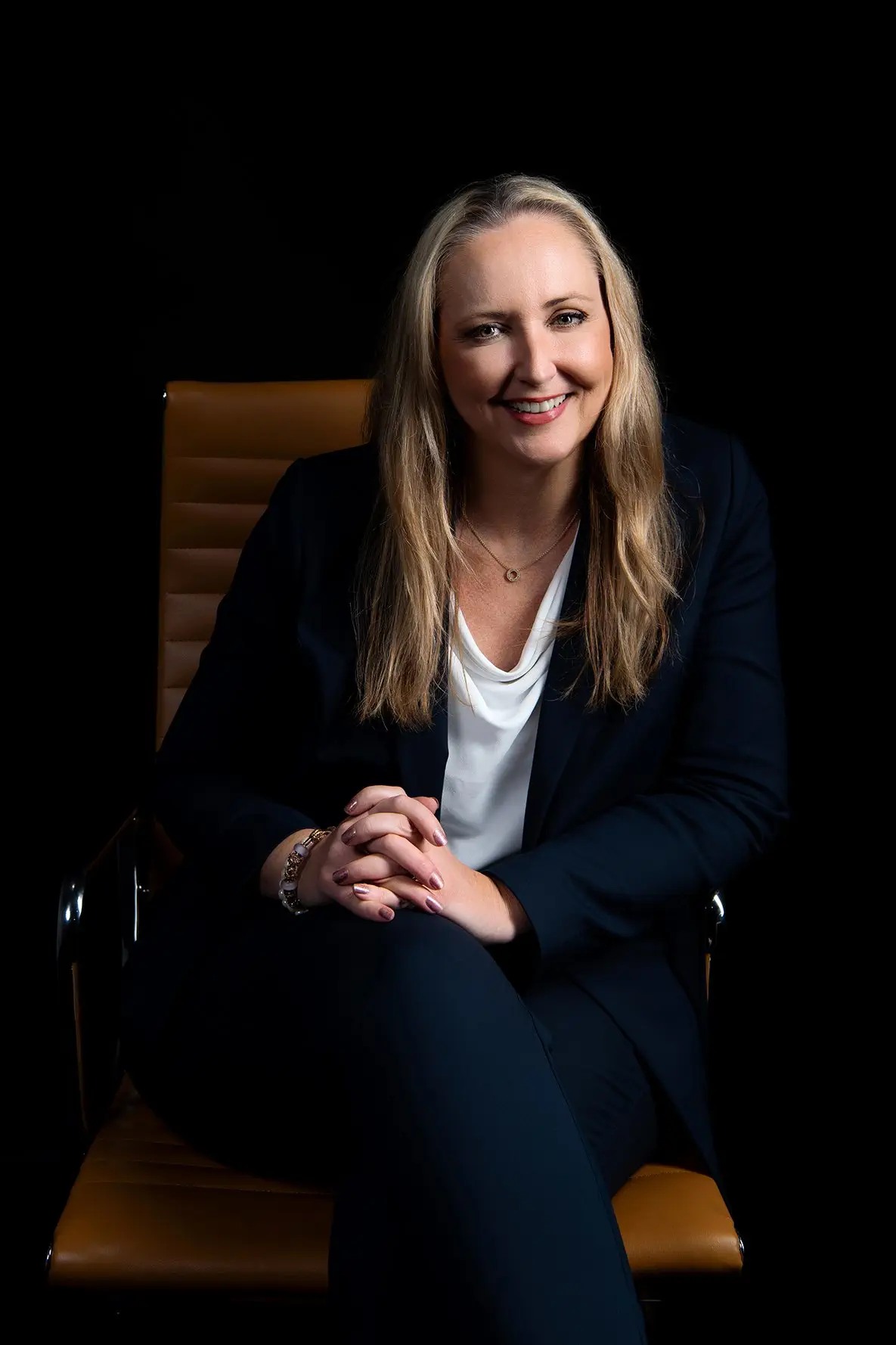 Confident businesswoman sitting in an office chair