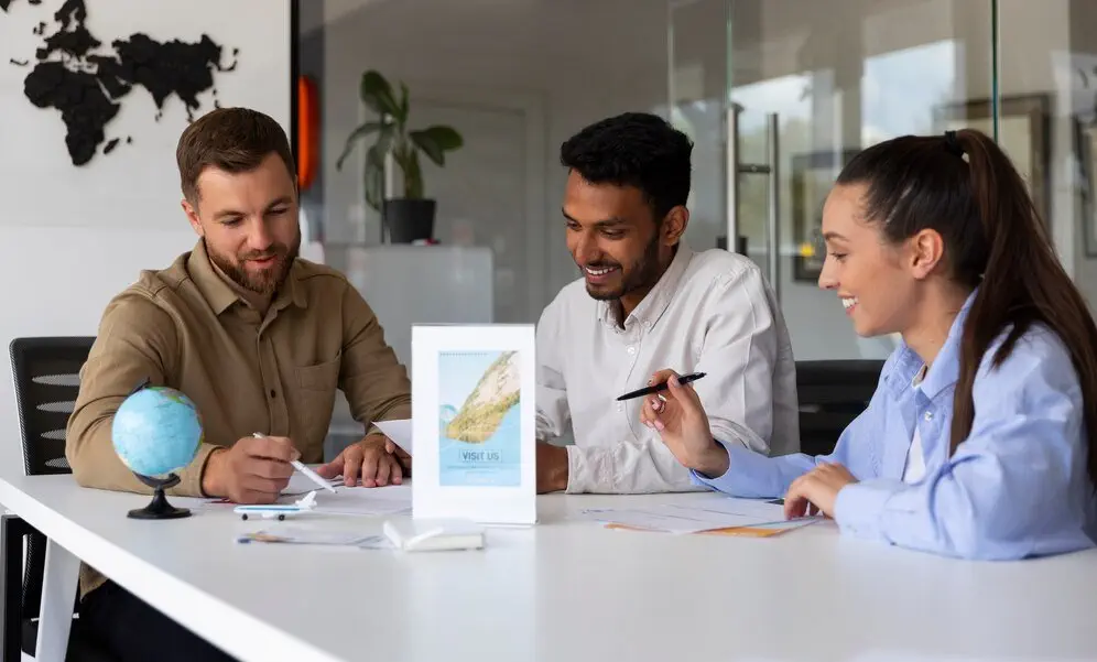 Three professionals discuss financial documents, focusing on British Virgin Islands taxation.